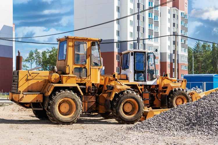 Construction equipment rental supporting a job site in Atascadero, California