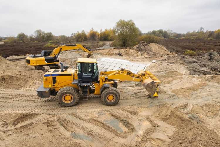 Earthmoving machinery operating on a New Braunfels construction project