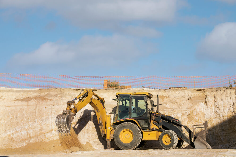 Excavator and compactor used in Raleigh construction project