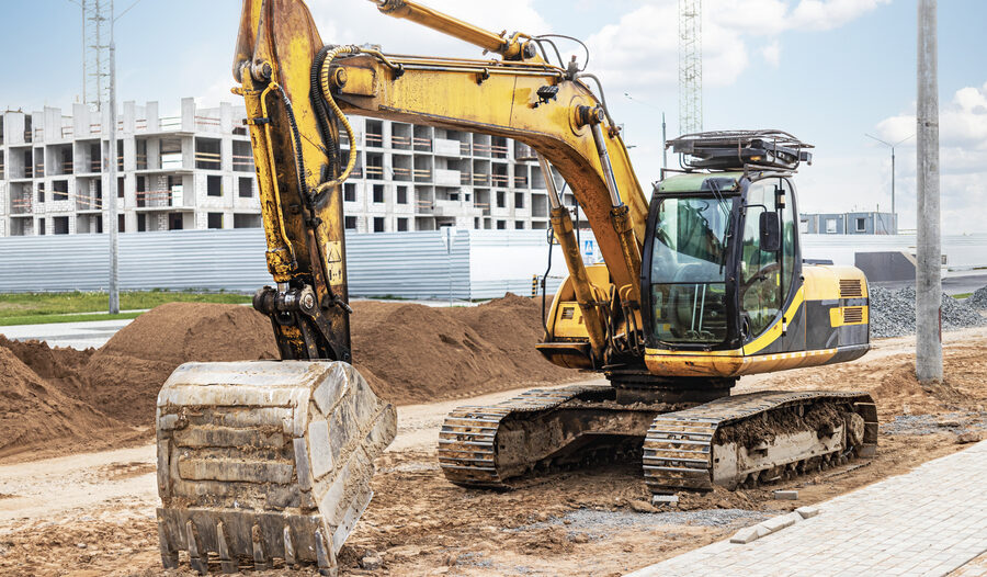 Excavator operating on a construction site in Irving, TX