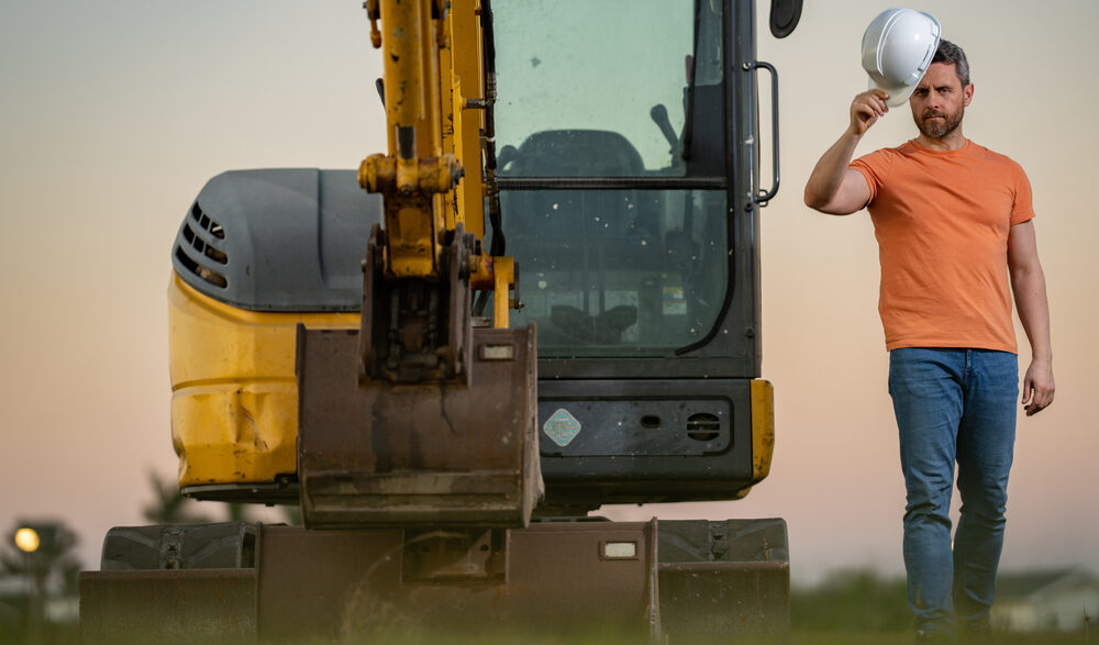 Excavator operating on a suburban construction site in Humble, Texas
