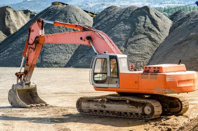 Excavators and earthmoving machinery preparing construction site in Milpitas, California