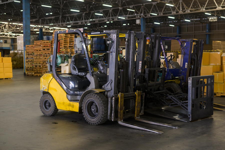 Forklift moving materials in a construction zone in Midland’s industrial district