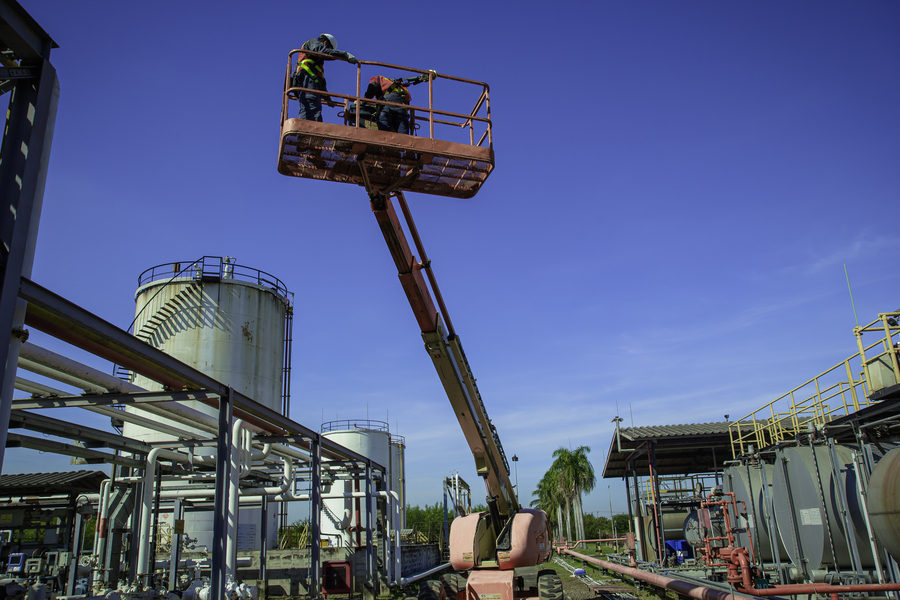 Forklift moving materials on an oilfield-adjacent construction site in Odessa, TX