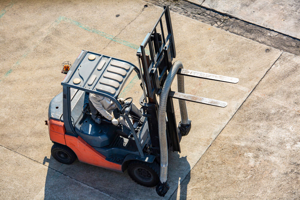 Forklift rental handling materials at a construction site in Roseburg, Oregon