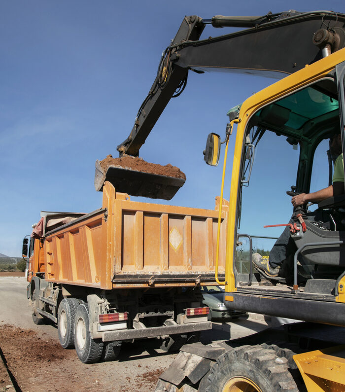 Forklift transporting materials on a construction site in Austin, Texas