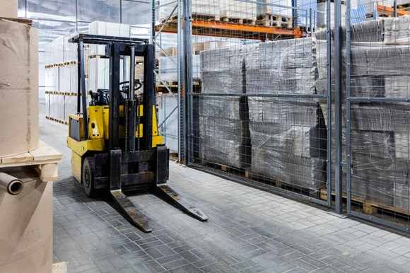 Forklift handling materials at an active Lathrop job site