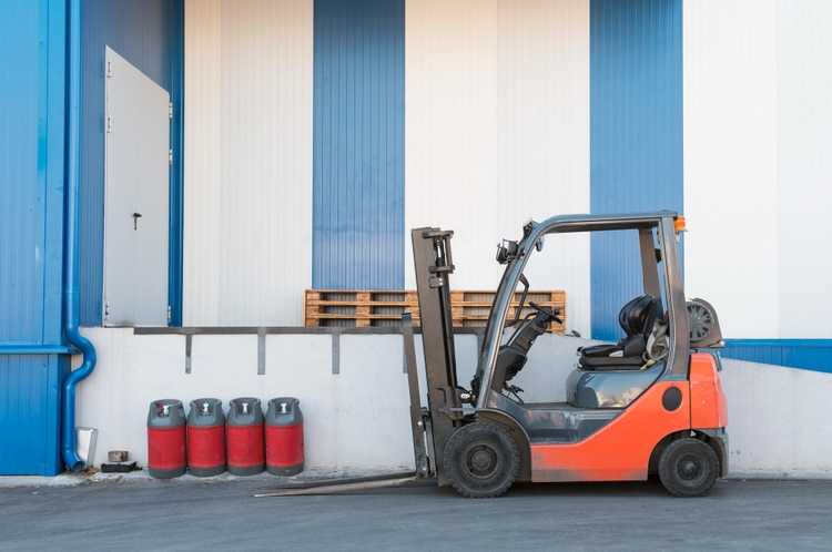 Forklift handling materials at an active Post Falls job site