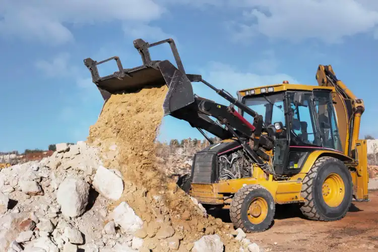 Heavy work skid steers working in Anniston by National Dispatching