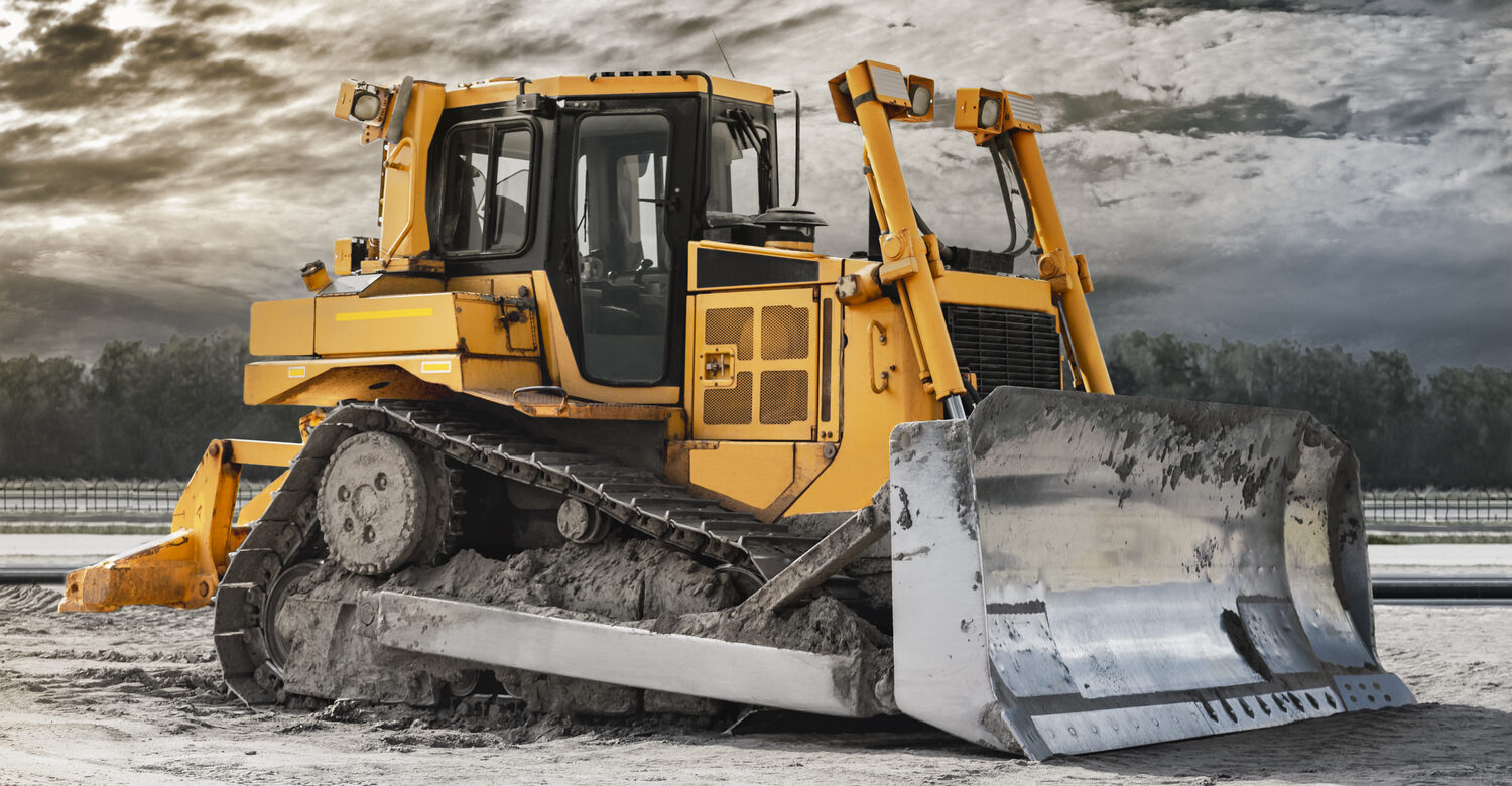 Bulldozer leveling construction site