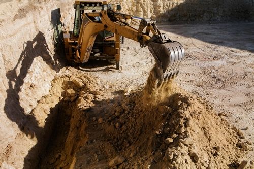 Heavy machinery supporting commercial construction project in Renton, Washington