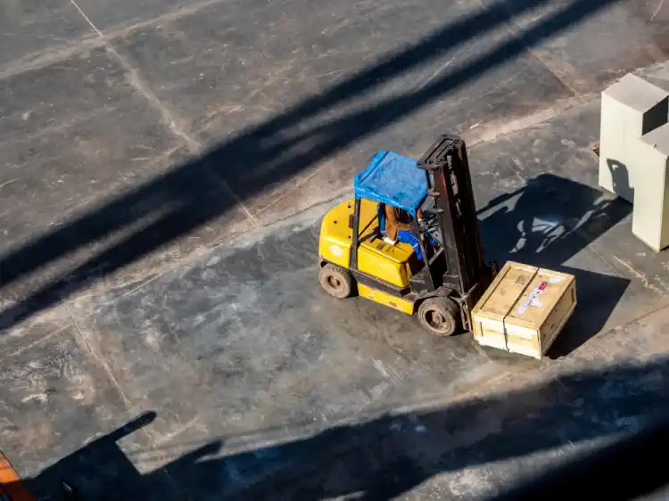 Forklift rental handling materials at an active Inyokern job site
