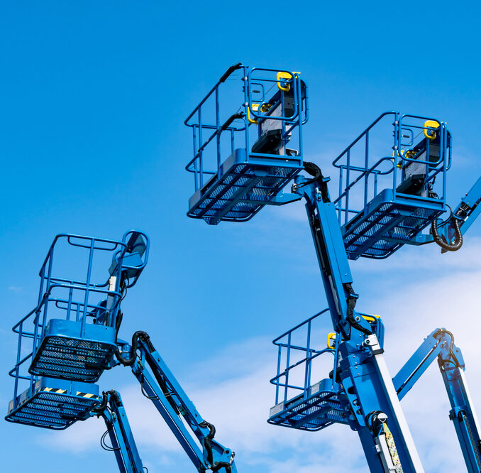 Boom lifts and scissor lifts used for elevated construction work in Sarasota, FL