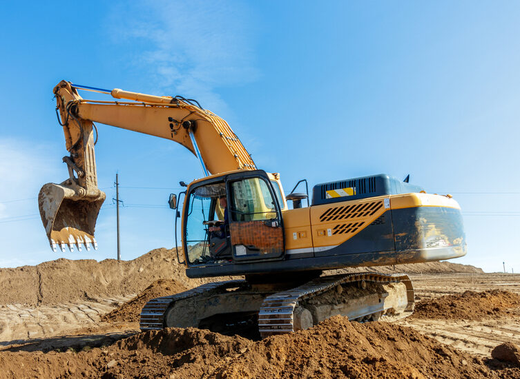 Excavator rental preparing a lot for site development in Denver, CO