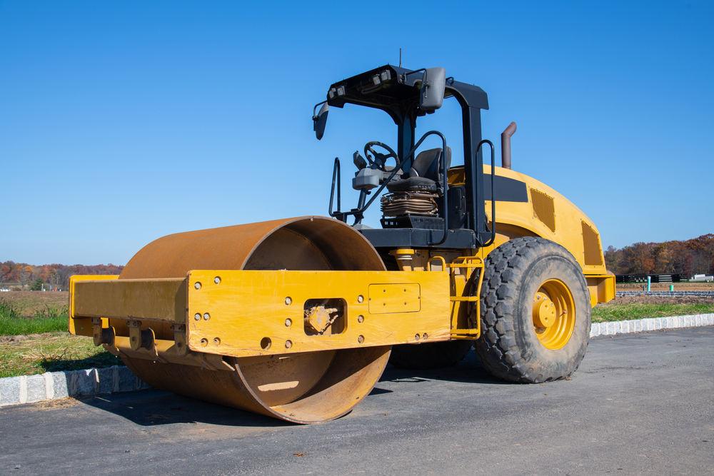 Drum roller compacting soil at a construction site in Livermore, CA