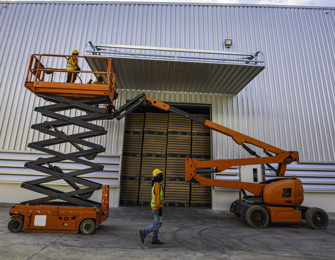Scissor lift being used on a commercial development project in Fort Lauderdale, Florida