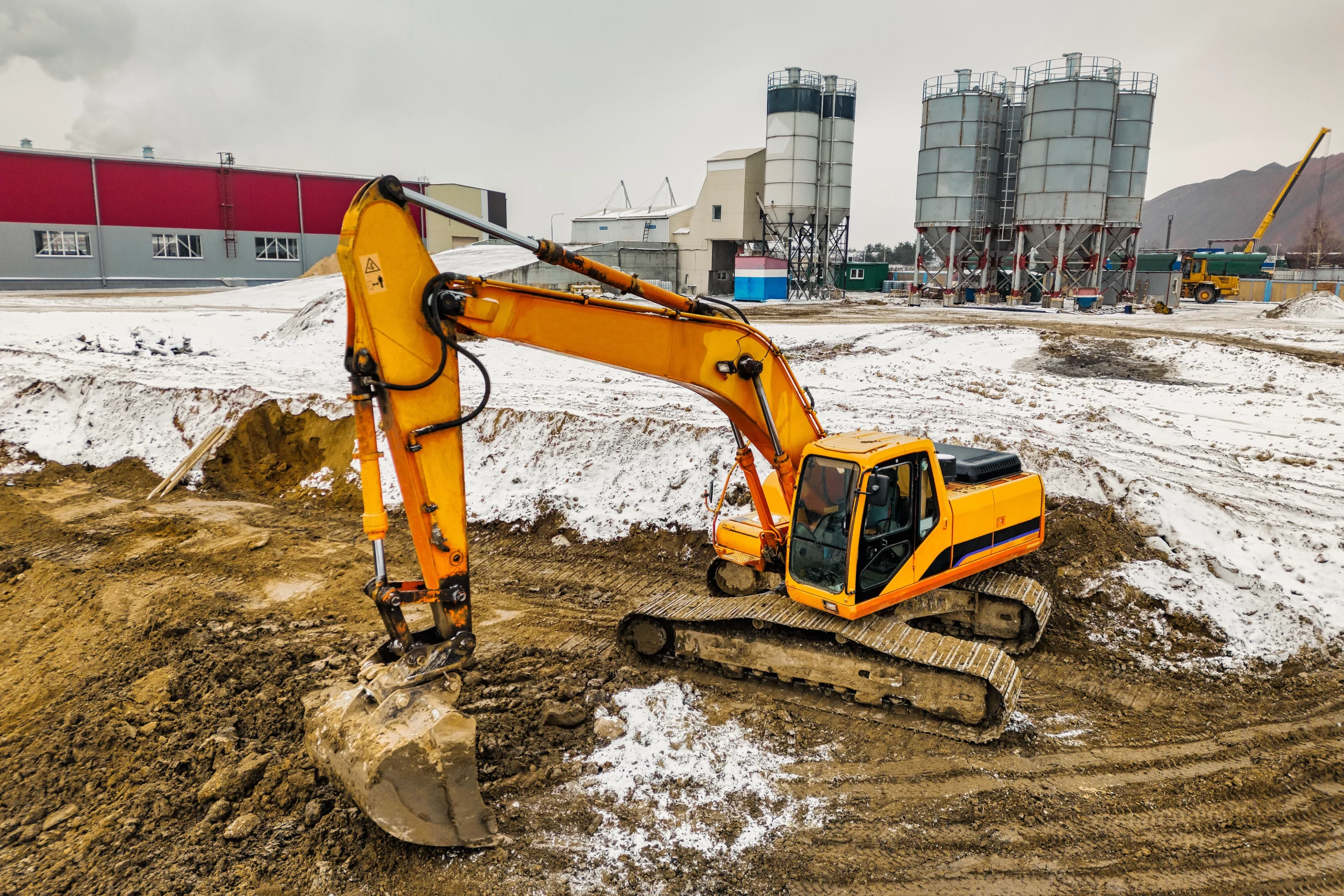 Heavy construction machinery in winter conditions