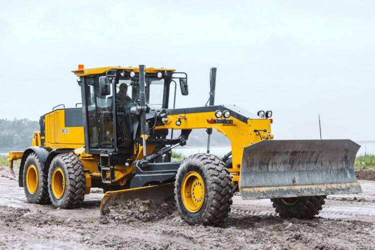 motor graders smoothing construction sites