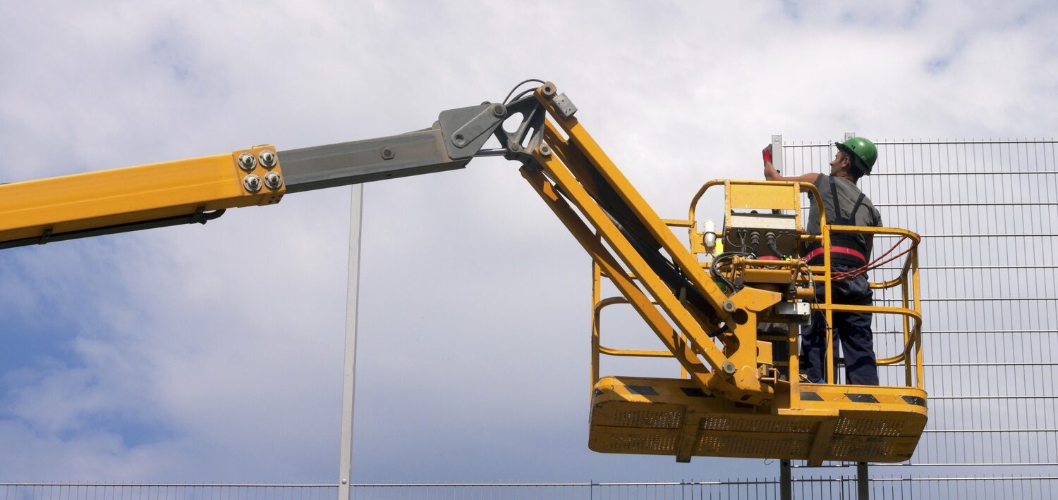 a labourer working on an aerial work platform.