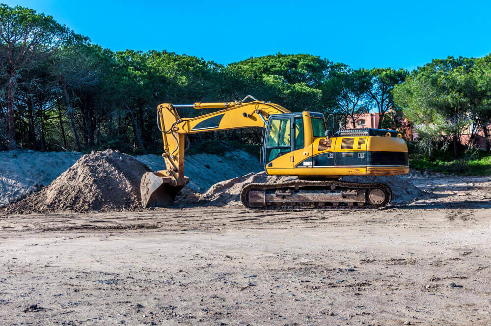 Excavator and compaction equipment working in Salisbury construction area