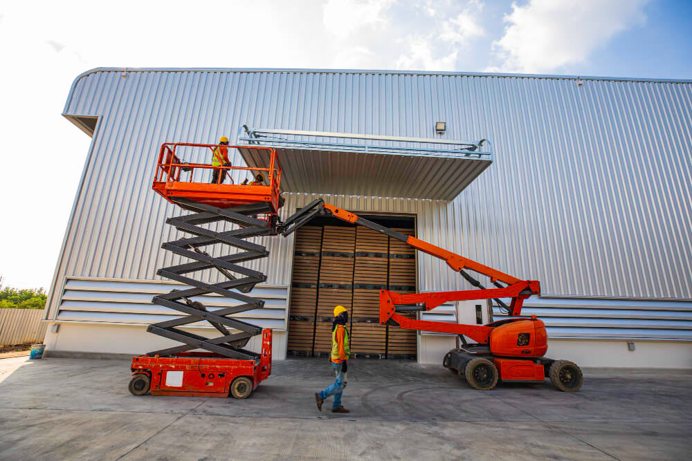 Scissor lift rental handling materials at a construction site in Wilsonville, Oregon